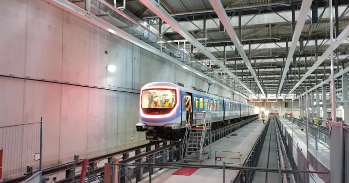 Metro train inside a modern rail maintenance facility